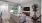 a living room with a couch and a fan