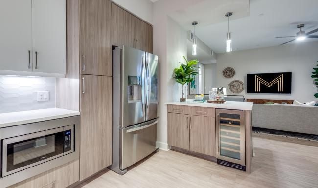 Find your perfect fit at Montrose at Buffalo Bayou a kitchen with a refrigerator and stove