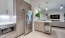 a kitchen with a refrigerator and stove