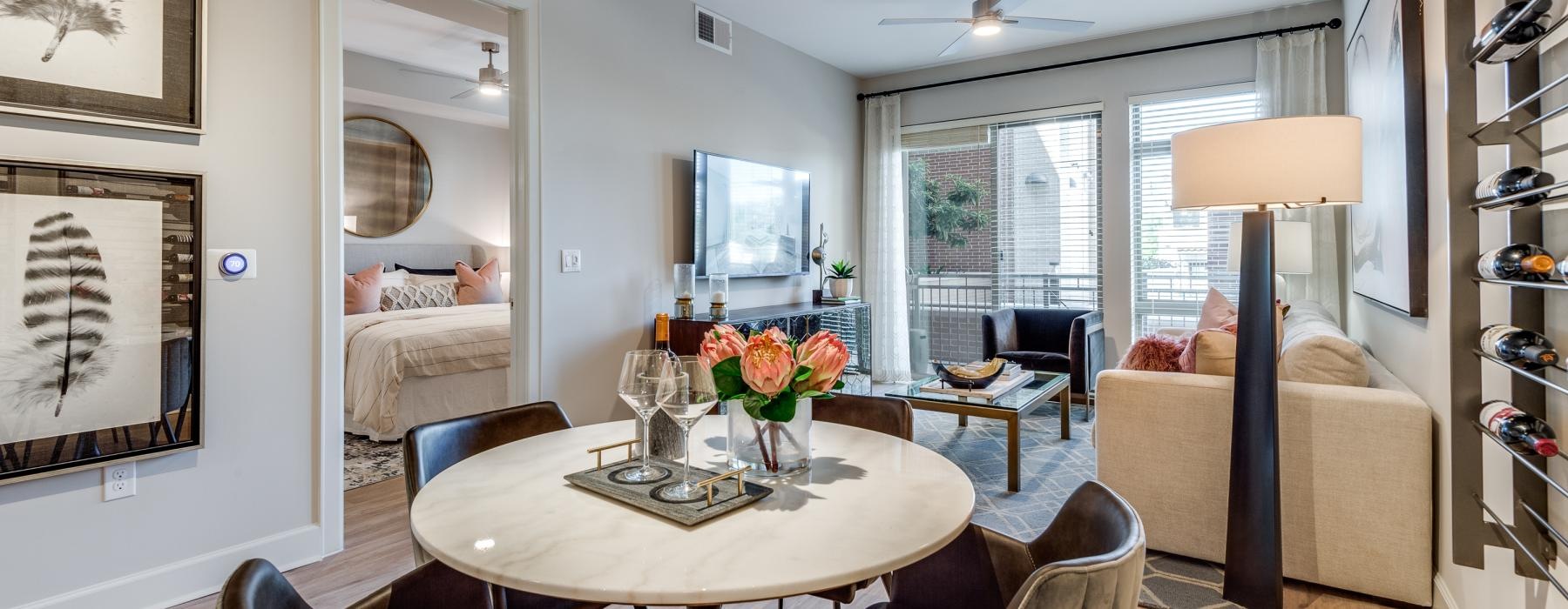 a living room with a table and chairs